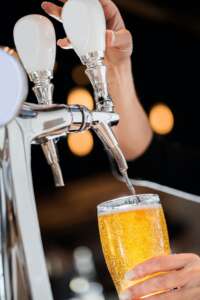 Pouring a Draft Blonde Beer from the Tap