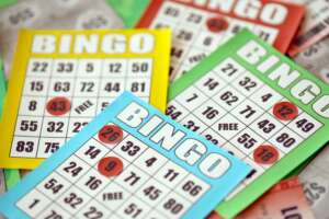 Many colorful bingo boards or playing cards for winning chips